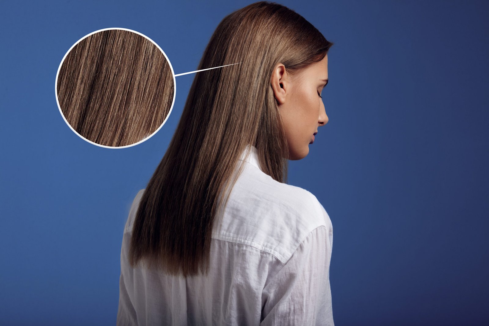 woman wears white shirt from backside showing ideal straight hai