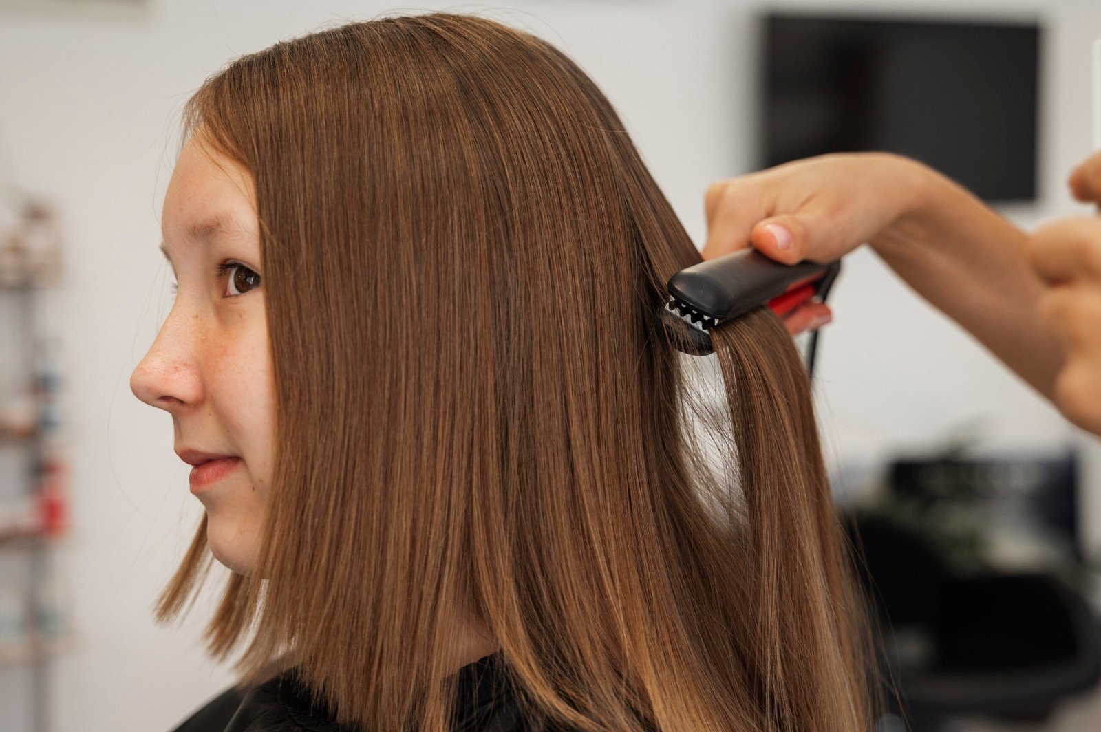 side-view-girl-getting-hair-styled-salon